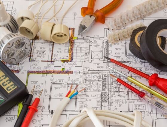 Electrical tools on top of electrical blueprint